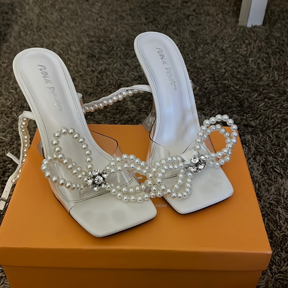 Selling Perl heels that tie at the ankle